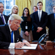 President Donald Trump signs executive order in the Oval Office of the White House on Jan. 24, 2017, in Washington, D.C. Looking on are White House chief of staff Reince Priebus, counselor to the president Kellyanne Conway, White House Communications Director Hope Hicks, senior adviser Jared Kushner (second right) and senior counselor Stephen Bannon. (Shawn Thew-Pool/Getty Images)